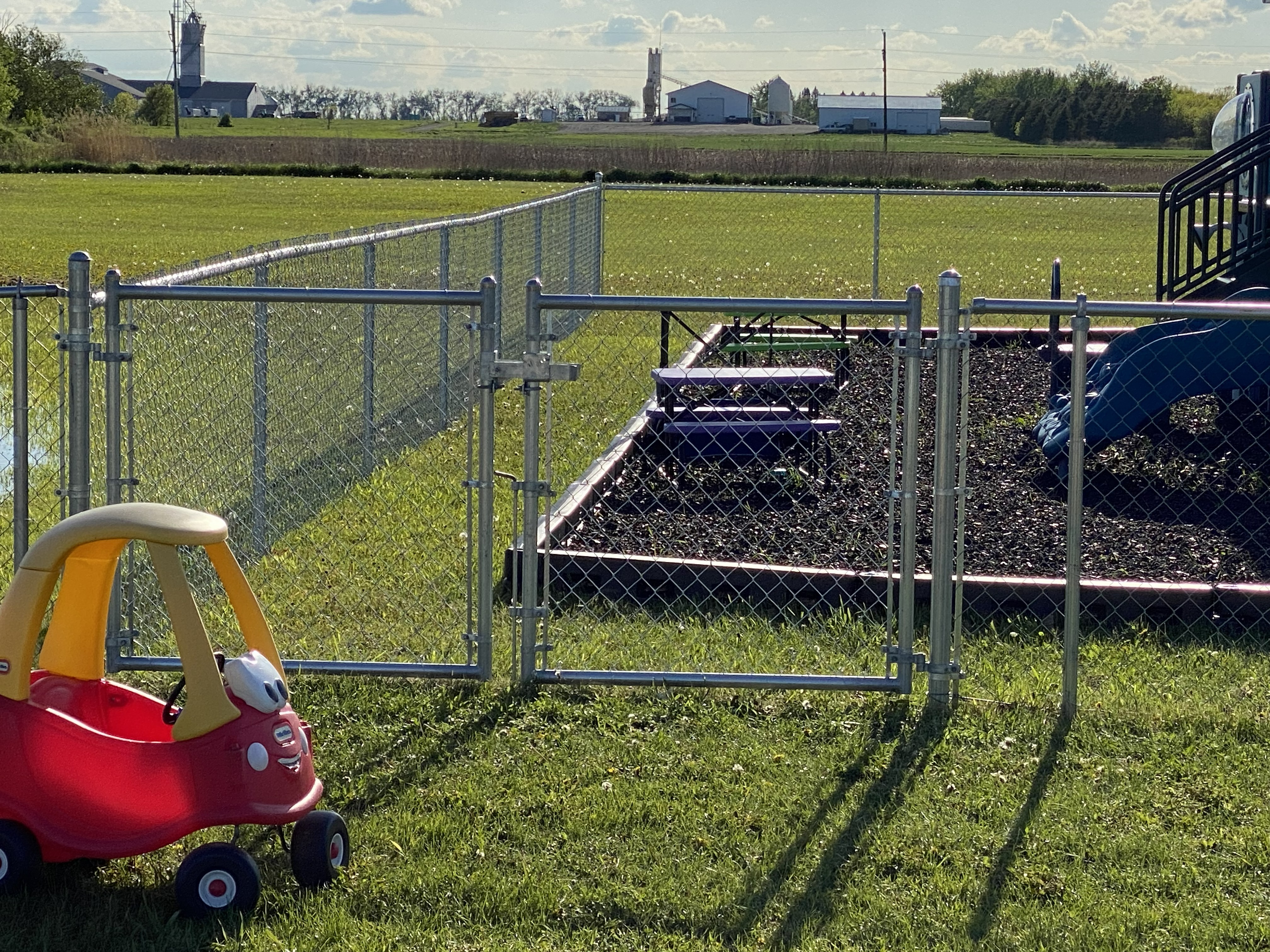 Playground enclosed with chain link fence